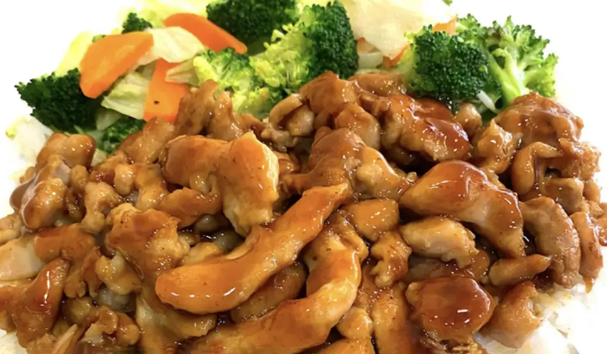 Chicken teriyaki dish served with steamed rice and fresh vegetables